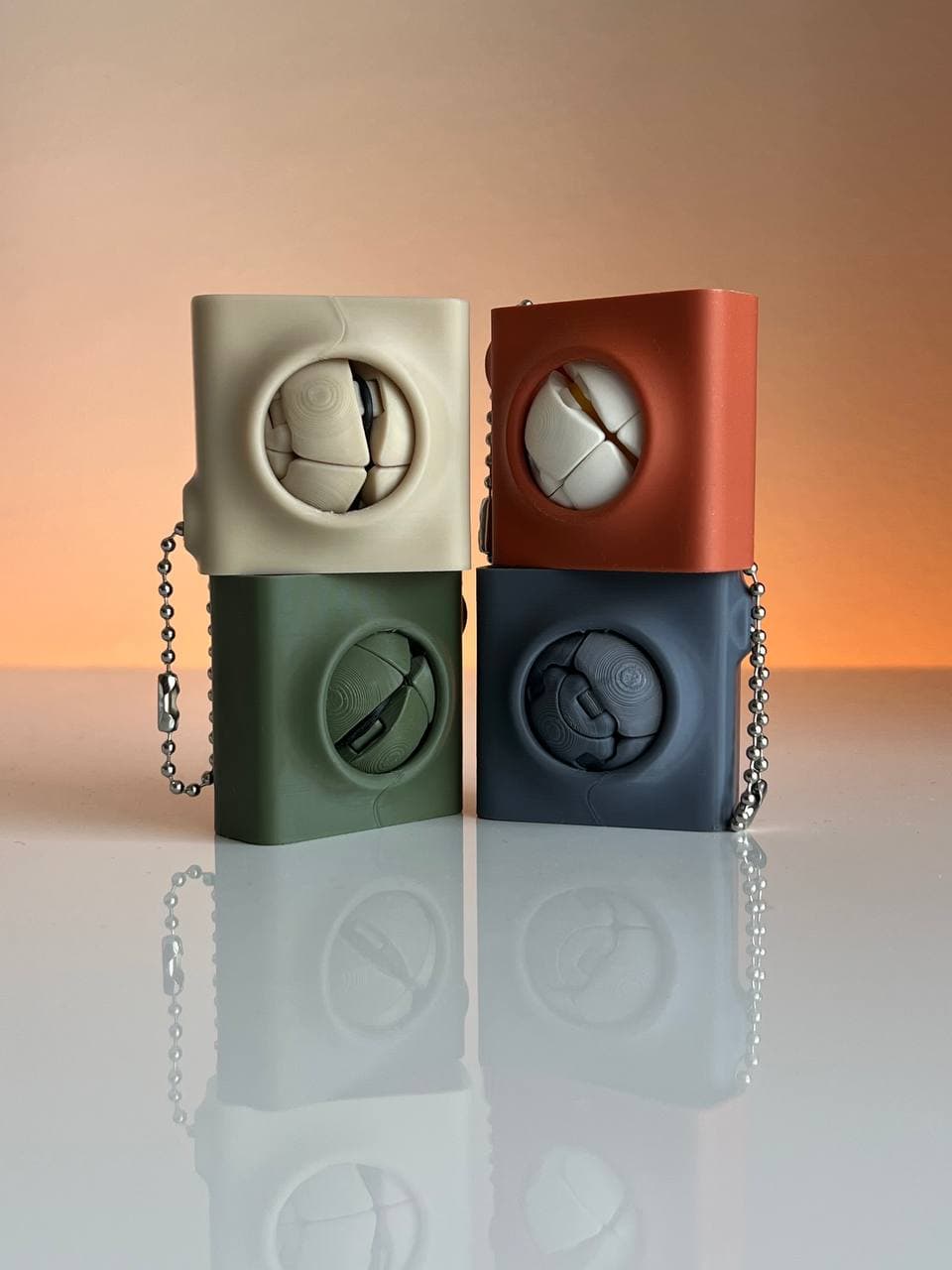 Zorbles anti-stress keychain in black, blue-grey, white and beige