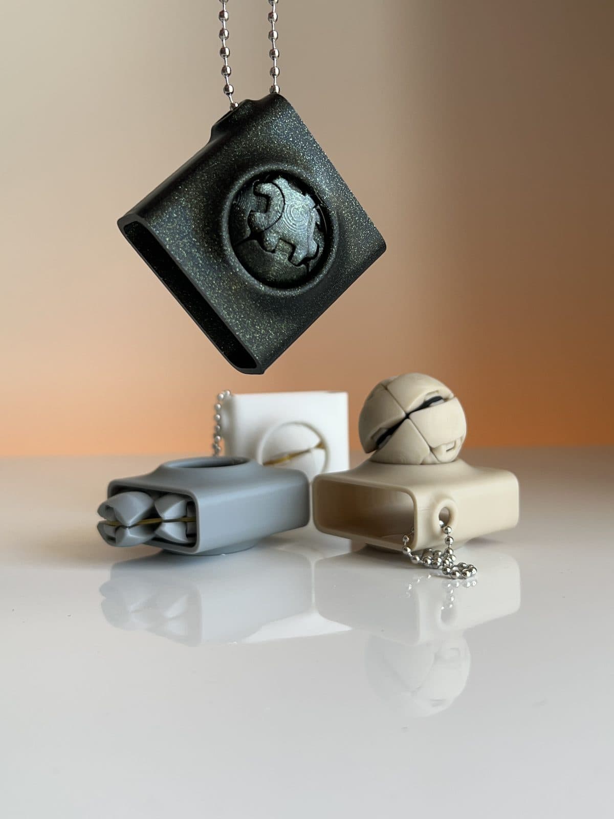 Zorbles anti-stress keychain in black, blue-grey, white and beige